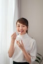 Beautiful of young Asian woman eating yogurt Royalty Free Stock Photo