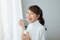 Beautiful of young Asian woman eating yogurt Royalty Free Stock Photo