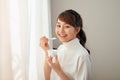 Beautiful of young Asian woman eating yogurt Royalty Free Stock Photo
