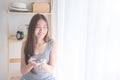 Beautiful woman eating yogurt with berries for breakfast Royalty Free Stock Photo