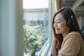 A beautiful young asian woman enjoy listening to music with headphone Royalty Free Stock Photo