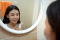 Beautiful Young Asian woman face wash with facial foam Royalty Free Stock Photo