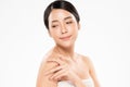 Beautiful Young Asian Woman hand Touching on Shoulder. Clean and Fresh skin, on white background, Beauty Cosmetology Concept Royalty Free Stock Photo