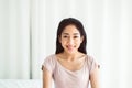 Beautiful young asian woman happy and smiling face and looking to camera while sitting at home Royalty Free Stock Photo