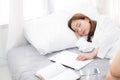 Beautiful young asian woman with laptop lying down in bedroom, girl tired sleep with computer notebook Royalty Free Stock Photo
