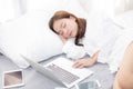 Beautiful young asian woman with laptop lying down in bedroom Royalty Free Stock Photo
