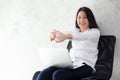 Beautiful young asian woman with laptop stretch and exercise relax after work success.