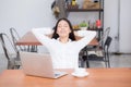 Beautiful young asian woman with laptop stretch and exercise relax after work success. Royalty Free Stock Photo