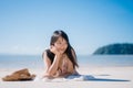 Beautiful Young Asian woman lying on beach happy relax near sea. Lifestyle women travel on beach concept Royalty Free Stock Photo