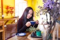 Beautiful young asian woman relaxing with coffee cup at coffee shop Royalty Free Stock Photo