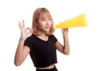 Beautiful young Asian woman show OK announce with megaphone. Royalty Free Stock Photo