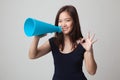 Beautiful young Asian woman show OK announce with megaphone. Royalty Free Stock Photo