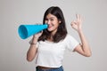 Beautiful young Asian woman show OK announce with megaphone. Royalty Free Stock Photo