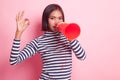 Beautiful young Asian woman show OK announce with megaphone. Royalty Free Stock Photo