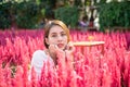 Beautiful young asian woman sitting in cockscomb flower garden Royalty Free Stock Photo