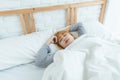 Beautiful young Asian woman sleeping in bed in the morning. Attractive asian girl use bedtime in her comfortable bedroom. Royalty Free Stock Photo