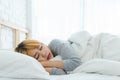 Beautiful young Asian woman sleeping in bed in the morning. Attractive asian girl use bedtime in her comfortable bedroom. Royalty Free Stock Photo