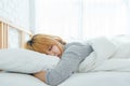 Beautiful young Asian woman sleeping in bed in the morning. Attractive asian girl use bedtime in her comfortable bedroom. Royalty Free Stock Photo