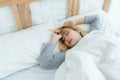 Beautiful young Asian woman sleeping in bed in the morning. Attractive asian girl use bedtime in her comfortable bedroom. Royalty Free Stock Photo