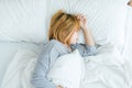 Beautiful young Asian woman sleeping in bed in the morning. Attractive asian girl use bedtime in her comfortable bedroom. Royalty Free Stock Photo