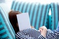 Beautiful young asian woman sleeping on sofa with book covering Royalty Free Stock Photo