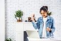 Beautiful young asian woman smiling celebrating success with arms up in front of laptop at home, Enjoying time Royalty Free Stock Photo