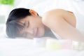 Beautiful of young asian woman smiling and lying on bed at bedroom, beauty of girl with hygiene and healthy. Royalty Free Stock Photo