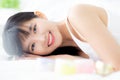 Beautiful of young asian woman smiling and lying on bed at bedroom, beauty of girl with hygiene and healthy. Royalty Free Stock Photo