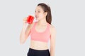 Beautiful young asian woman in sport after workout drinking water from glass for thirsty isolated on white background Royalty Free Stock Photo