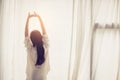 Beautiful young asian woman stretch and relax in bed after wake up morning at bedroom. Royalty Free Stock Photo