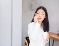 Beautiful young asian woman talking phone and smile in the coffee shop. Royalty Free Stock Photo