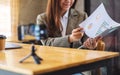 A beautiful young woman teaching business class online with laptop computer on the table Royalty Free Stock Photo