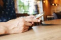 Beautiful young asian woman using smartphone and holding card for shopping online payment . Shopping concept with copy space. Royalty Free Stock Photo