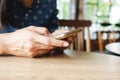 Beautiful young asian woman using smartphone and holding card for shopping online payment . Shopping concept with copy space. Royalty Free Stock Photo