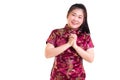 Beautiful Young asian woman wear chinese dress traditional cheongsam or qipao. With gesture of congratulation, Royalty Free Stock Photo