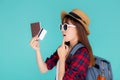 Beautiful young asian woman wear hat and sunglasses with showing credit card and passport thinking idea in planning to travel