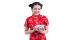 Beautiful Young asian woman wearing chinese dress traditional cheongsam or qipao. Hands holding and using laptop. Royalty Free Stock Photo