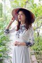 Beautiful young Asian woman wearing traditional cone hat