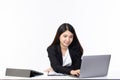 Beautiful young asian woman working on laptop computer while sitting smile, happy and relax at the office room isolated on white Royalty Free Stock Photo