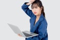 Beautiful young asian woman working and looking laptop computer with exhausted and worried isolated