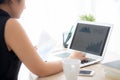 Beautiful young asian woman working and typing with laptop computer at office Royalty Free Stock Photo