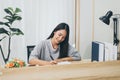 Beautiful young asian woman writing diary or story from home Royalty Free Stock Photo