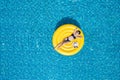 Beautiful young asian woman with yellow inflatable ring relaxing in swimming pool. top view Royalty Free Stock Photo