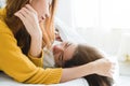 Beautiful young asian women LGBT lesbian happy couple hugging and smiling while lying together in bed under blanket at home. Royalty Free Stock Photo