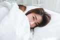 Beautiful young asian women LGBT lesbian happy couple hugging and smiling while lying together in bed under blanket at home. Royalty Free Stock Photo