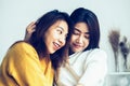 Beautiful young asian women LGBT lesbian happy couple sitting on bed hugging and smiling together in bedroom at home. Royalty Free Stock Photo