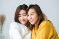 Beautiful young asian women LGBT lesbian happy couple sitting on bed hugging and smiling together in bedroom at home. Royalty Free Stock Photo