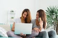 Beautiful young asian women LGBT lesbian couple sitting on sofa buying online using laptop a computer and credit card. Royalty Free Stock Photo