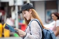 beautiful Young Asian women tourist traveler smiling with backpack on the Traffic Road using and looking at map in China town Ya