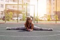 beautiful young athletic girl doing stretching outdoor